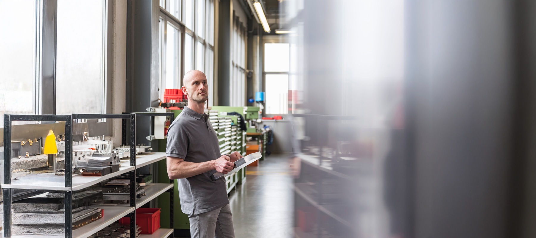 AI generated content image of a man looking around in a naturally lit lab room