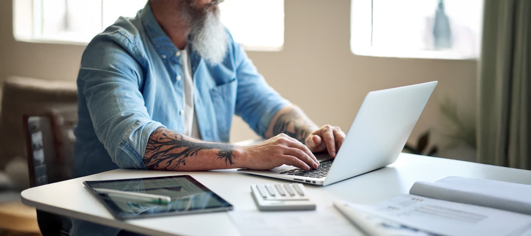 AI generated content image of a businessman working on his laptop at a table